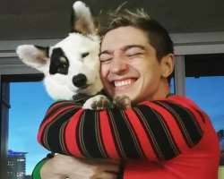 He is accompanied by a dog named Geno in his home. He loves to cuddle him and play with him whenever he gets time.